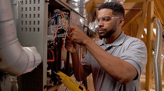 Technician working on furnace